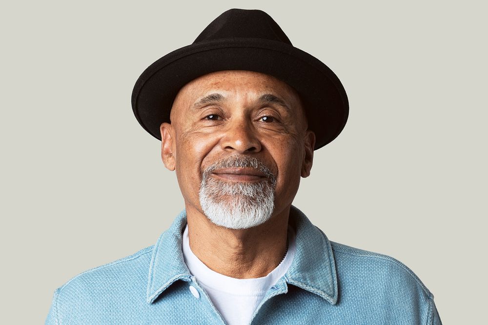 Mature man smiling face closeup portrait on green background