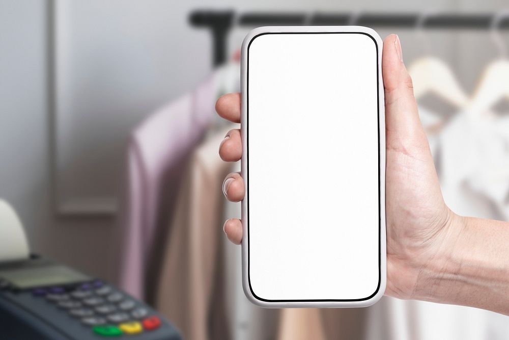 Hands holding smartphone with blank screen