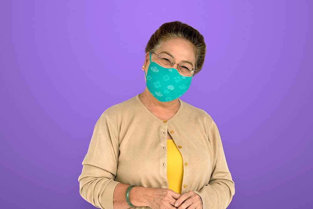 Senior woman wearing face mask to prevent Covid 19