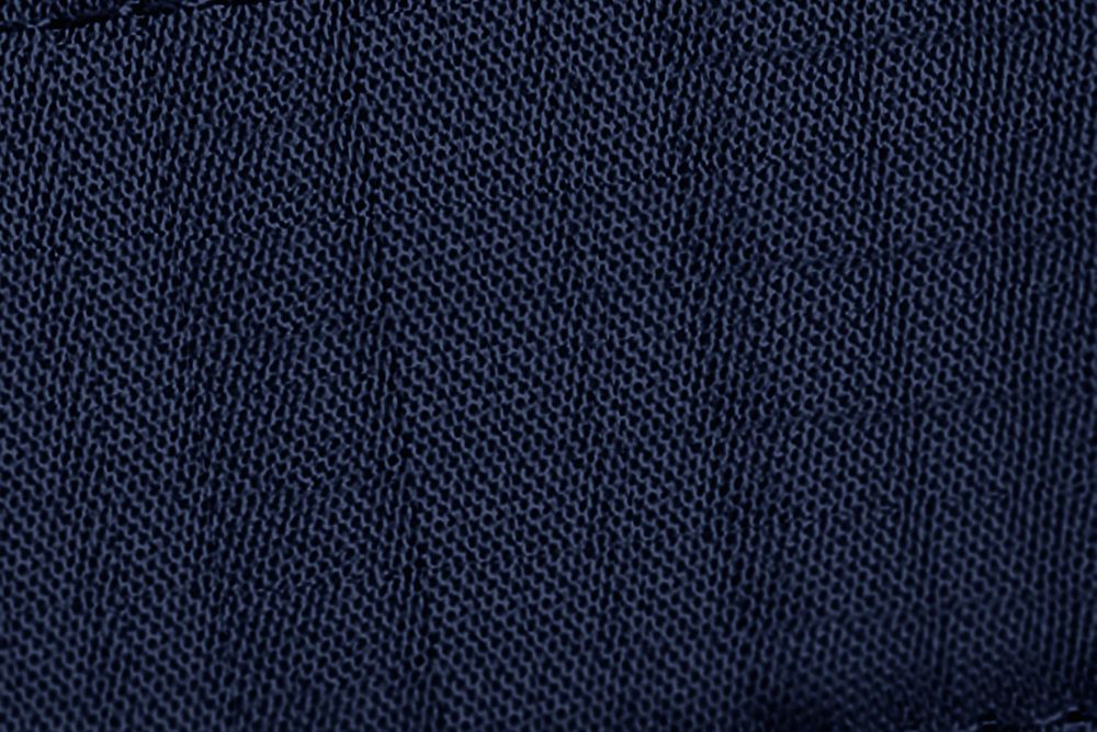 Navy blue denim background in fabric texture