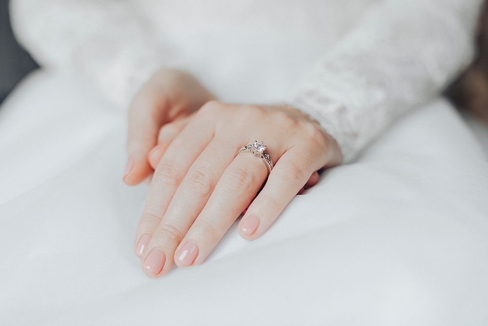 Engagement ring on bride&rsquo;s hand closeup, wedding photography