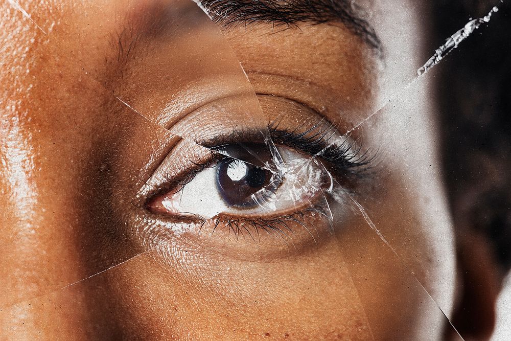 Broken glass on eyes background, remixed media design