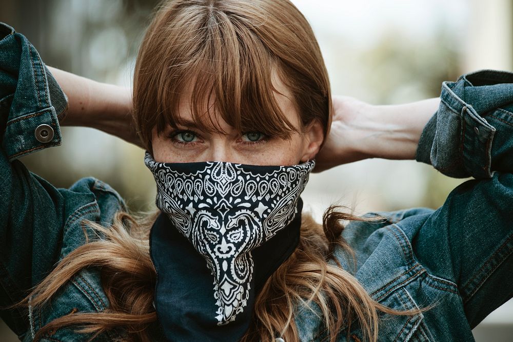 Woman covering her mouth with a bandana during coronavirus outbreak 