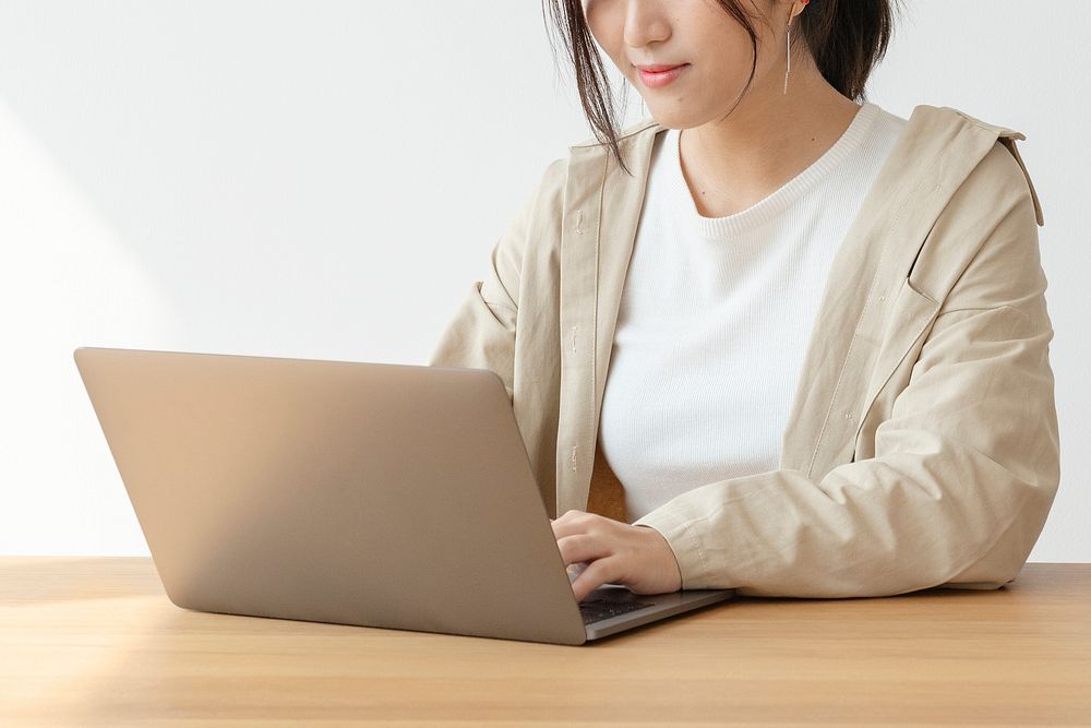 Asian woman at home using a laptop 