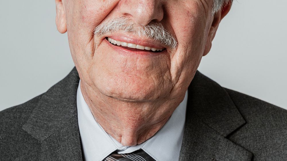 Cropped face of a happy senior businessman
