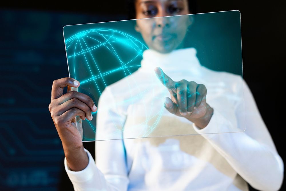 African American woman using transparent tablet futuristic technology