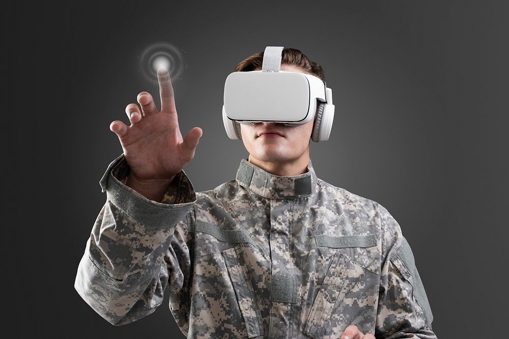 Military in VR headset touching virtual screen