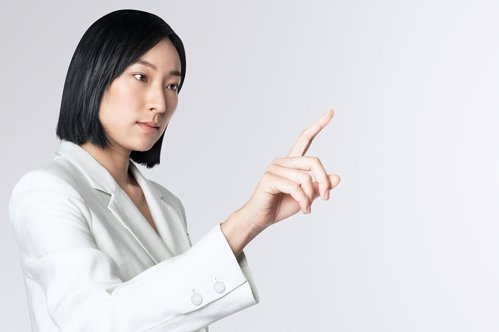 Futuristic digital presentation by an Asian businesswoman