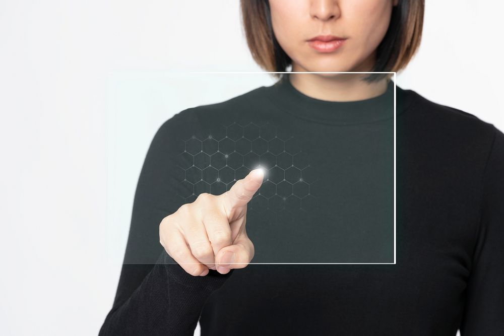 Businesswoman touching invisible screen future technology