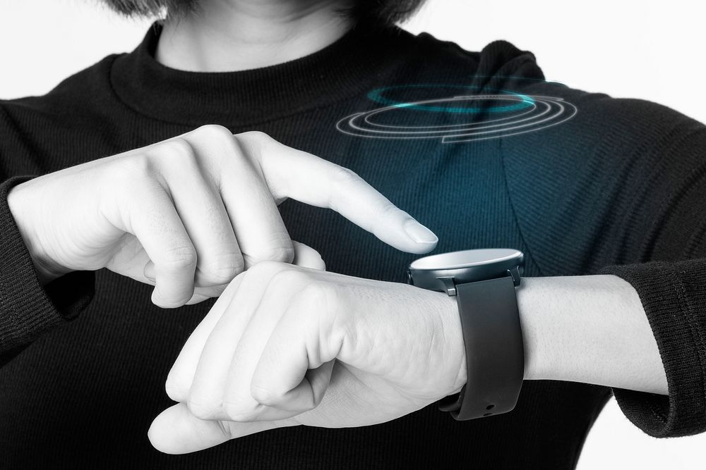 Woman playing with smart watch technology