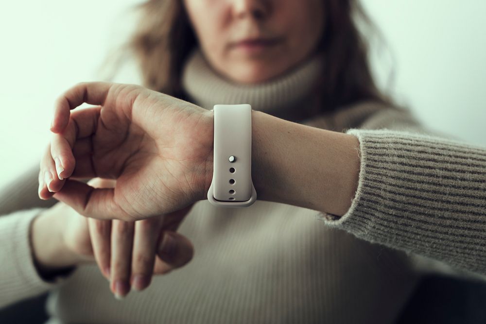 Woman looking at smartwatch wearable technology