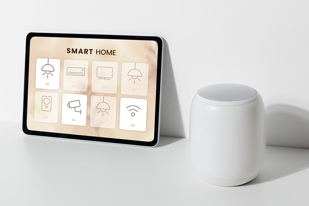 Smart home app on tablet with voice assistant speaker