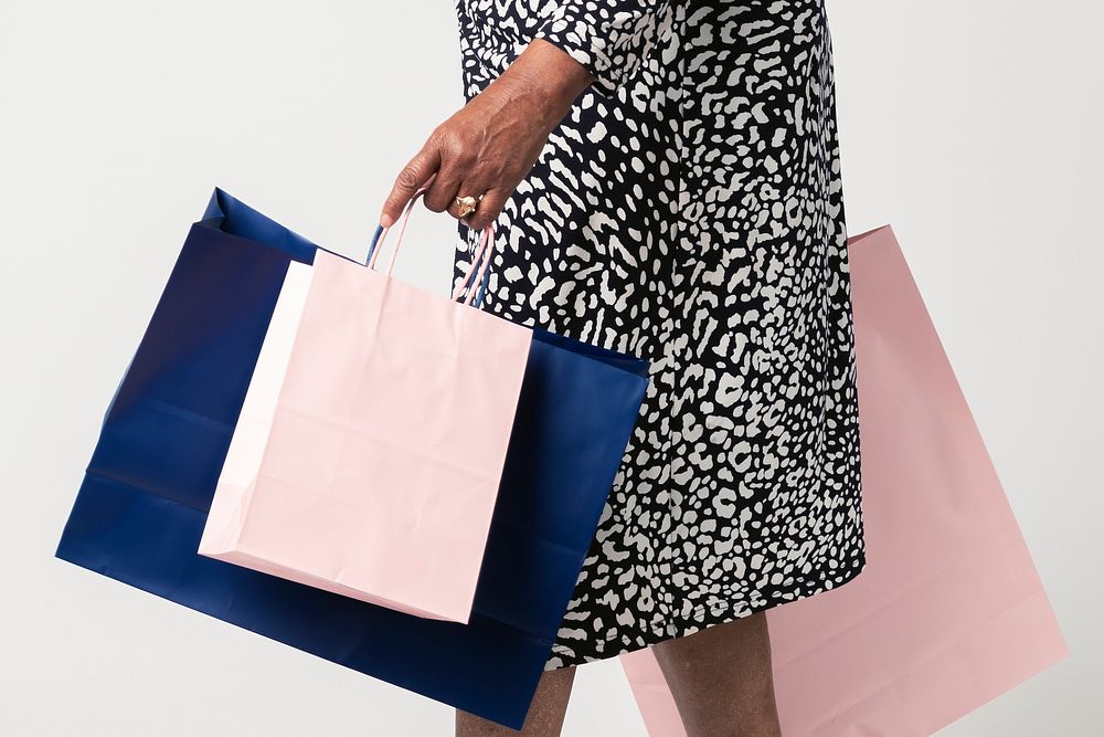 Black woman carrying shopping bag