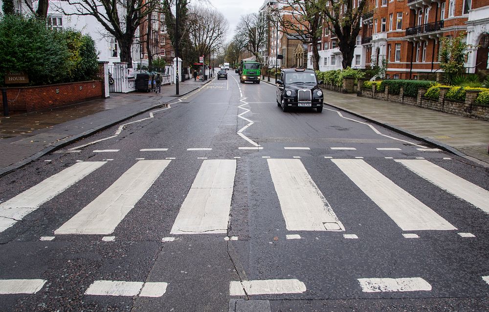 Zebra crossing in england with cars photo, free public domain CC0 image.