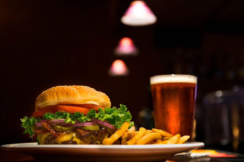 Burger and beer in a pub. Original public domain image from Wikimedia Commons