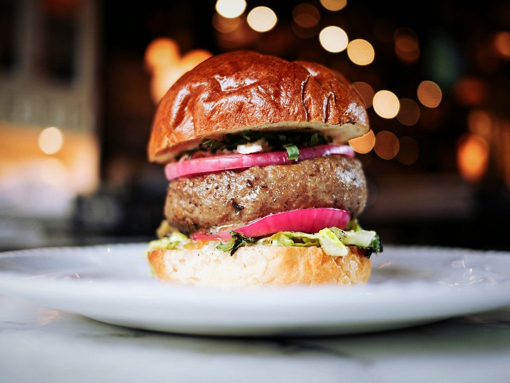 Gourmet restaurant hamburger with red onions. Original public domain image from Wikimedia Commons