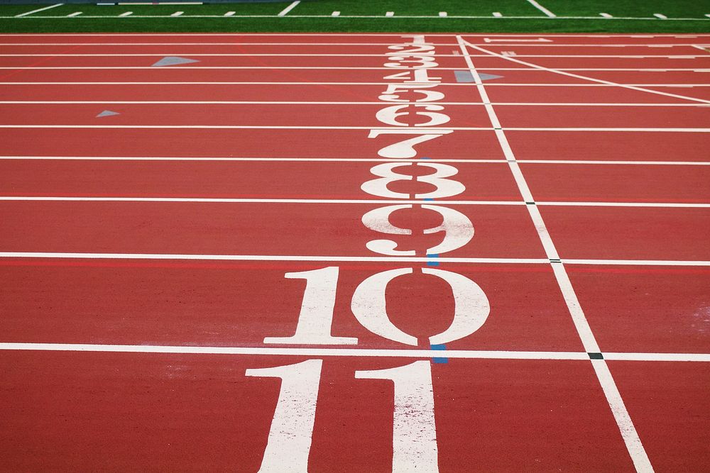 Numbers along the starting line on a running track. Original public domain image from Wikimedia Commons