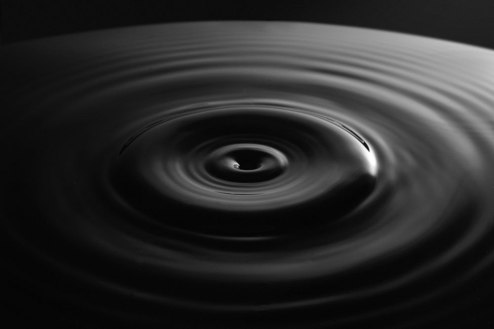 Close-up photo of water ripple. Original public domain image from Wikimedia Commons