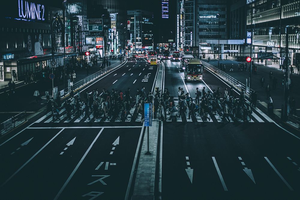 A crowded crosswalk in Tokyo at night. Original public domain image from Wikimedia Commons
