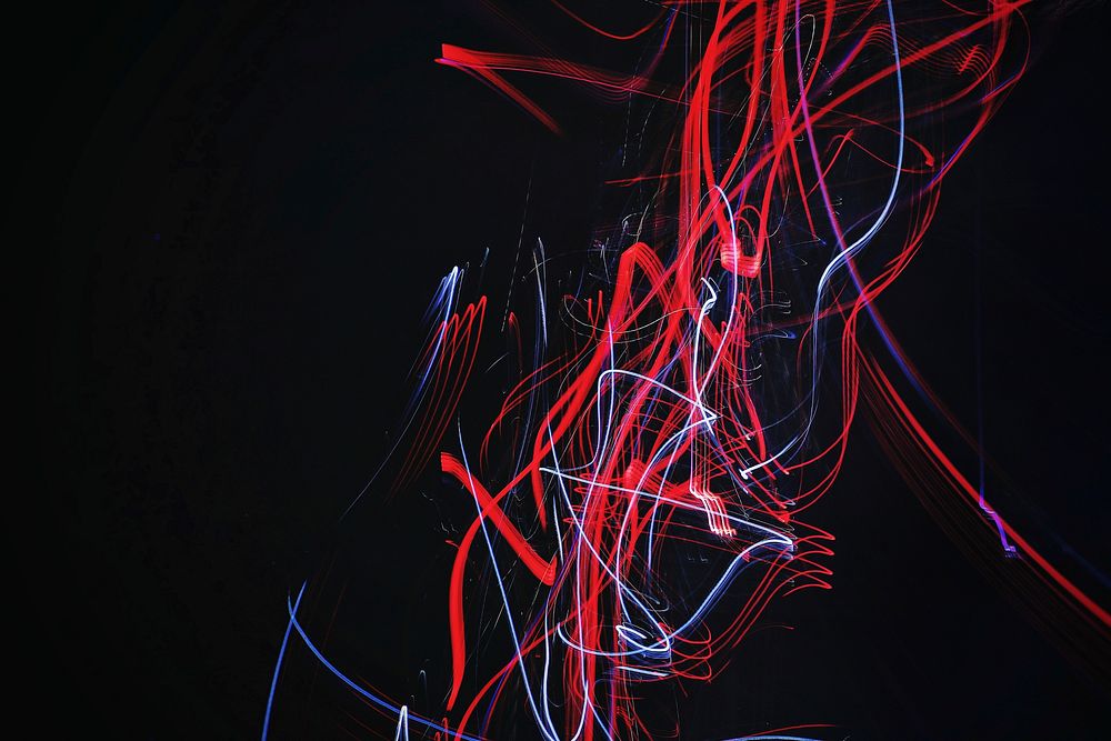 A light trail of neon red and silver. Original public domain image from Wikimedia Commons