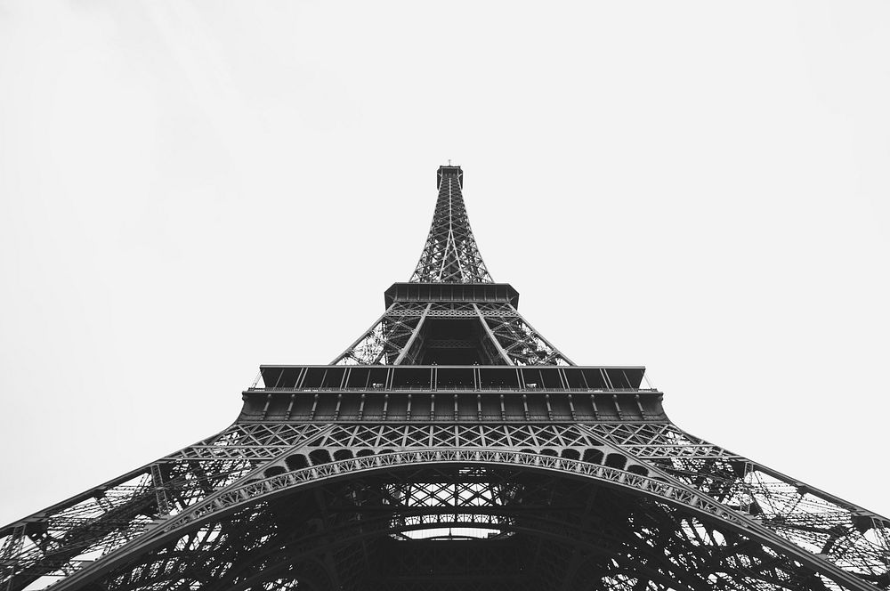 The landmark Eiffel Tower in Paris, France with a gray background. Original public domain image from Wikimedia Commons