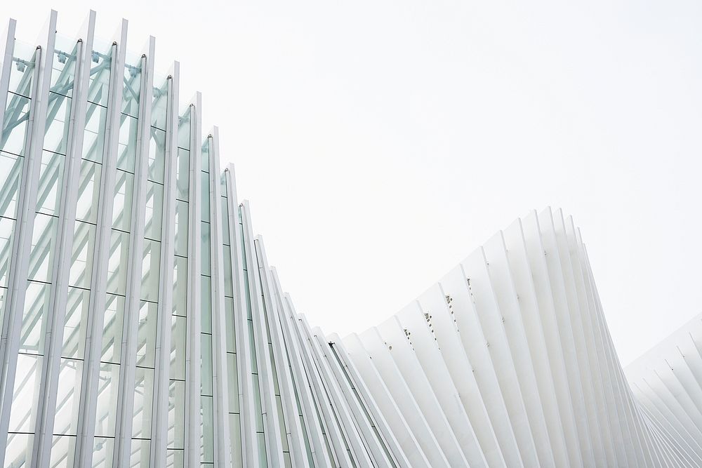 White concrete ribs in the undulating glass facade of a modern building. Original public domain image from Wikimedia Commons