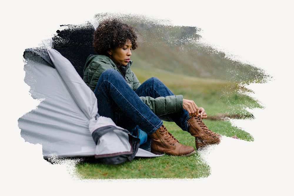Woman tying her shoelaces by her tent image element