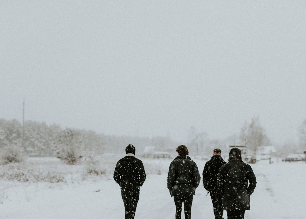 Men walking down a snowy road