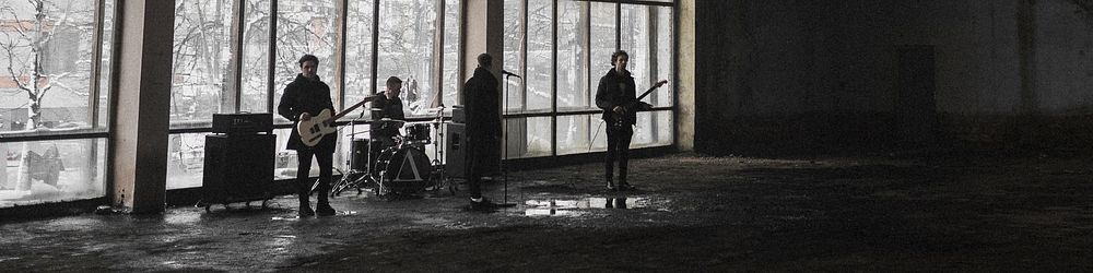 Rock band rehearsing in an abandoned building social banner