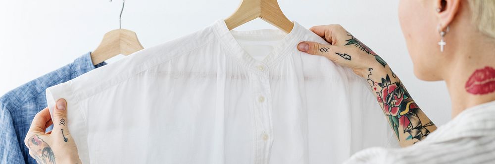 Woman looking at a white shirt