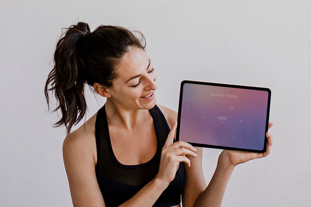 Yoga instructor showing a digital tablet mobile phone wallpaper