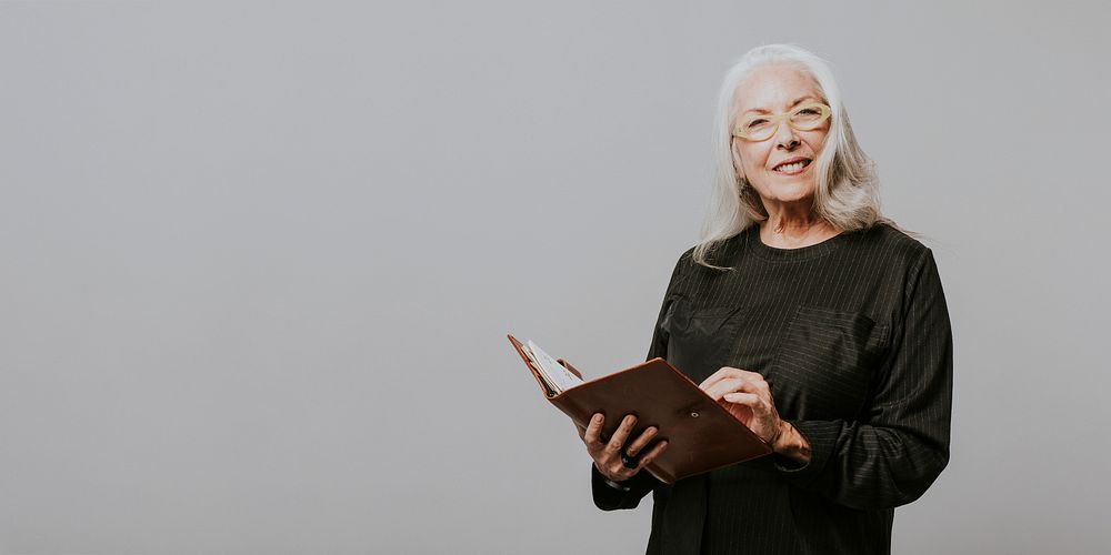 Senior businesswoman holding a personal notebook