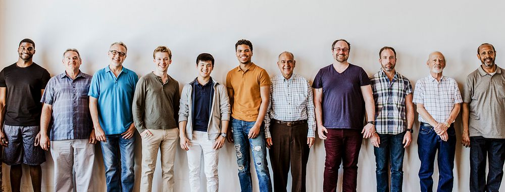 Cheerful diverse men standing in a line