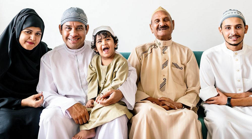 Muslim family relaxing in the home