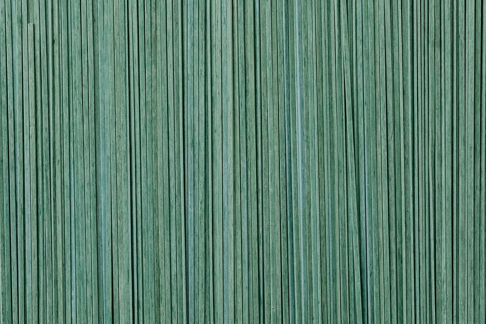 Green uncooked tagliatelle textured background