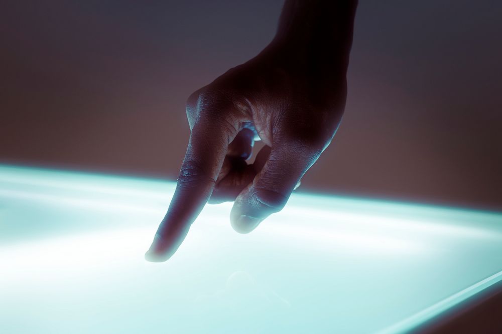 Hand touching transparent presentation screen