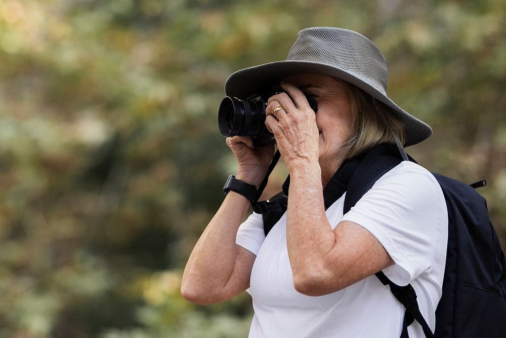Woman capturing the beauty of the nature
