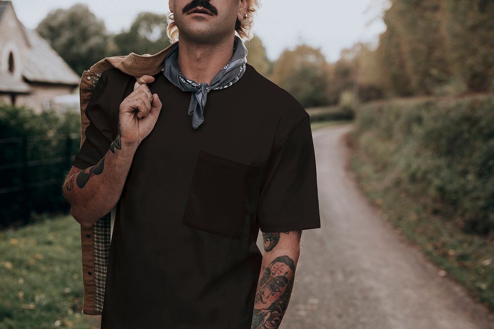 Man with mustache wearing black t-shirt with design space