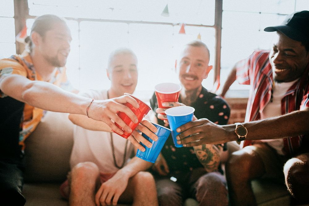 Group of diverse friends toasting at a party
