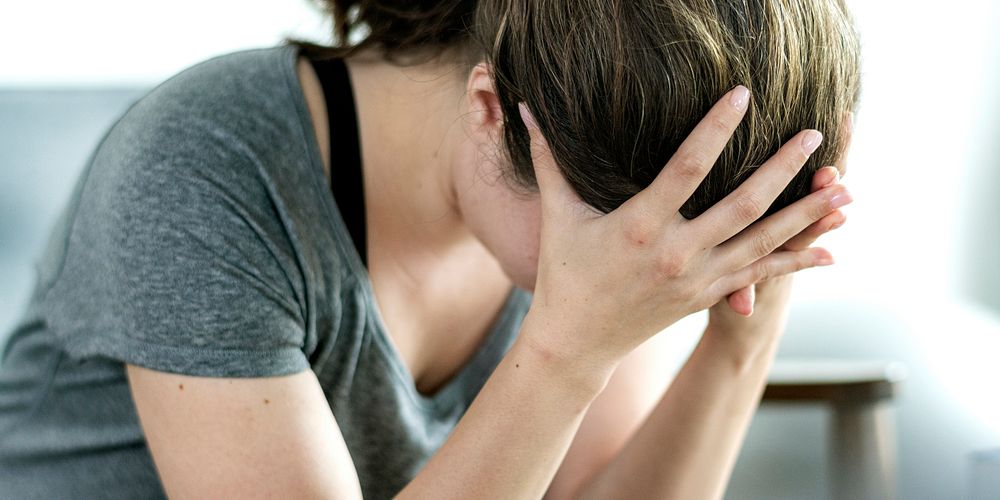 Emotionally stressed woman not feeling well