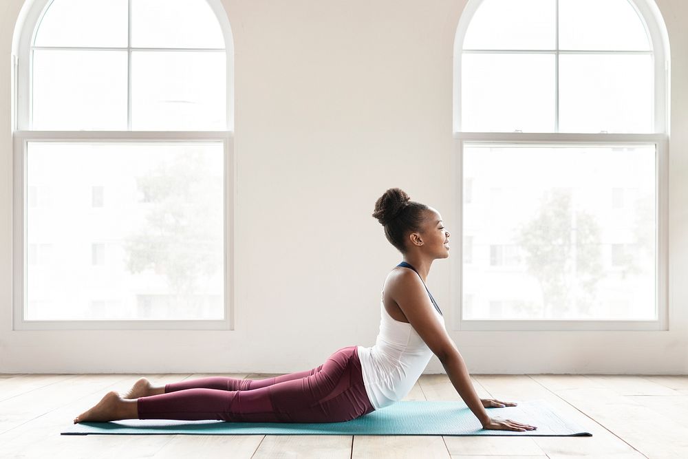 Black lady doing a Bhujangasana pose