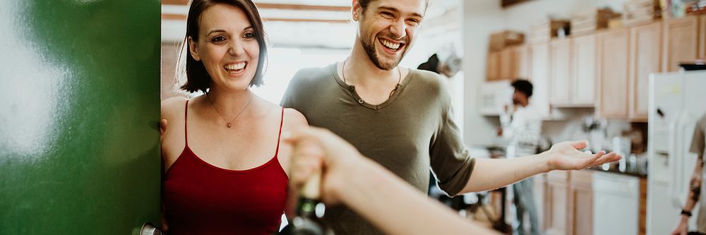 Woman presenting a bottle of red wine