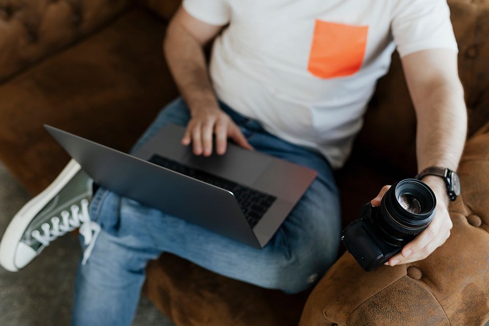 Photographer editing on his laptop