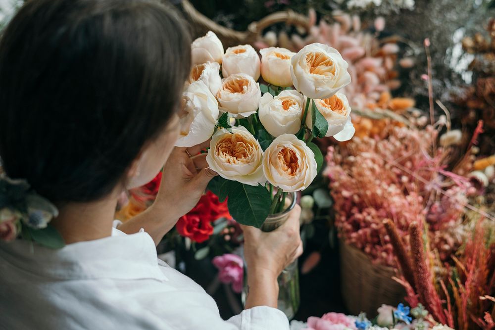 Woman picking up some Romantic Vuvuzela Roses