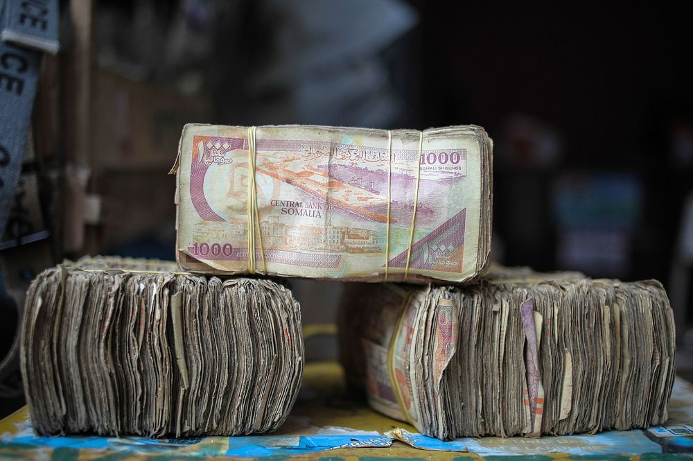 Bundles of Somali shilling notes are seen at a money exchangers stall on the streets of the Somali capital Mogadishu.