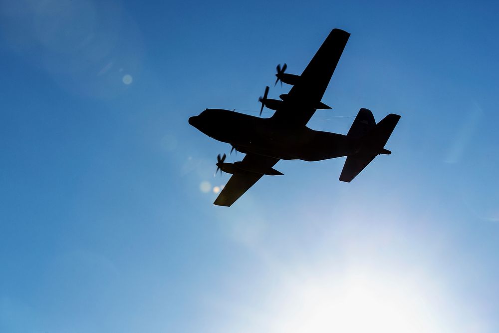 A U.S. Air Force C-130 Hercules aircraft transporting Airmen returning from a deployment to Southwest Asia flies over Yokota…
