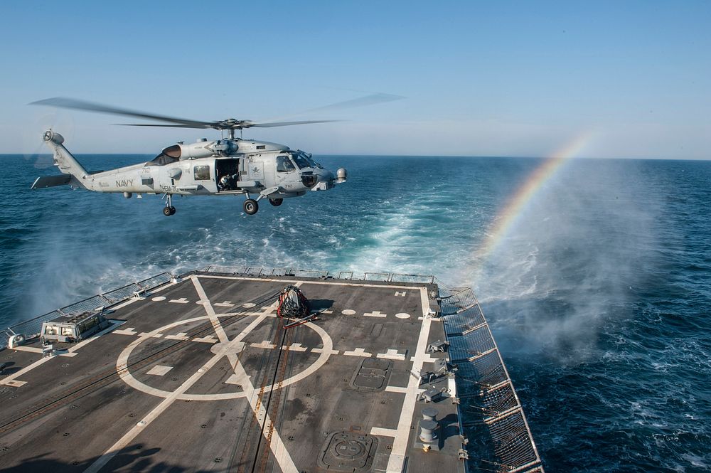 A U.S. Navy MH-60R Seahawk helicopter assigned to Helicopter Maritime Strike Squadron (HSM) 70 practices a vertical…