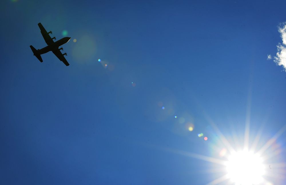 A U.S. Air Force C-130J Super Hercules aircraft flies over the flight line during an unimproved landing zone training…