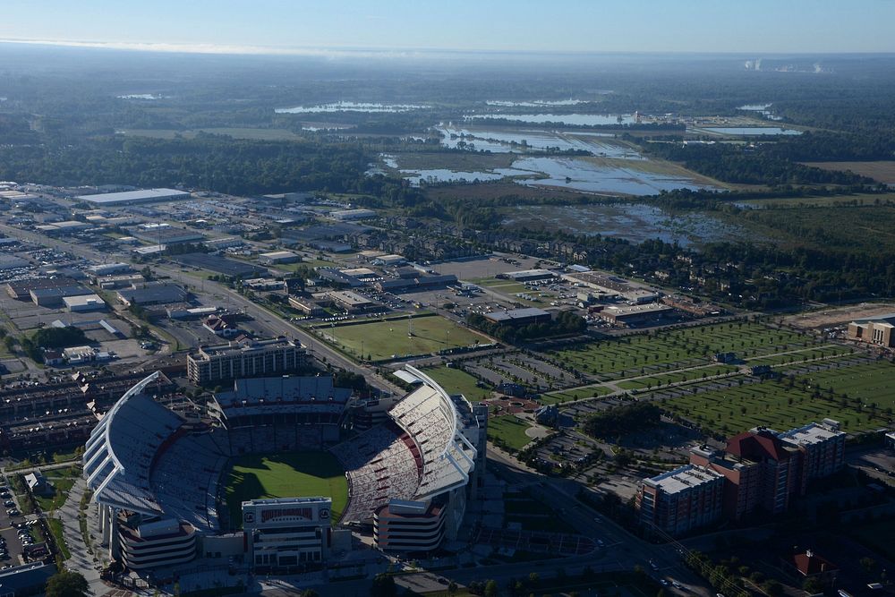 Aerial photo of South Carolina flood damage while a U.S. Army CH-47 Chinook helicopter from the South Carolina Army National…