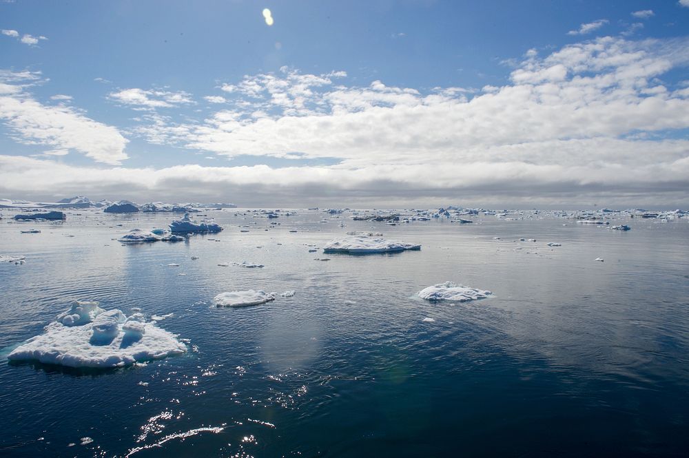 Icebergs float off the port of Ilulissat, Greenland, as U.S. Secretary of State John Kerry passes by aboard HDMS Thetis on…